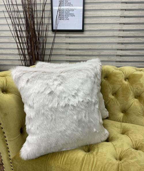 Light coloured faux fur cushion covers