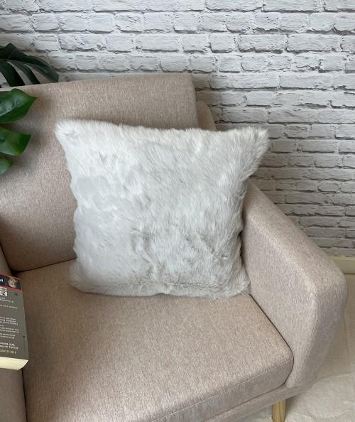 Pale coloured fake fur pillows