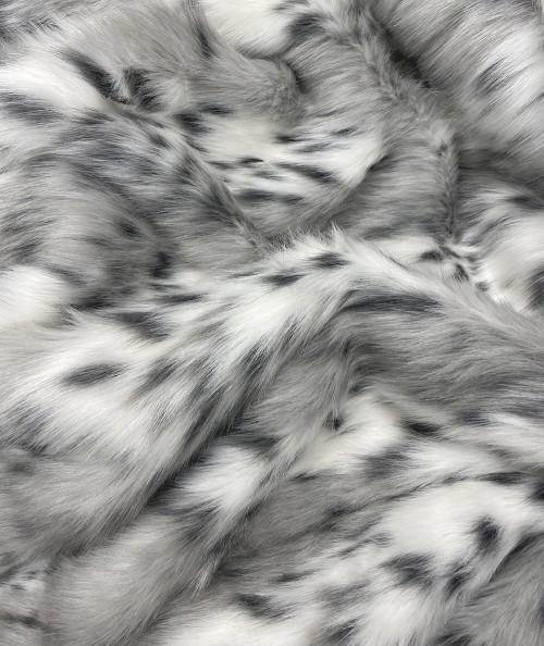 Close up image of the spotted lynx faux fur fabric Close up image of the spotted lynx faux fur fabric