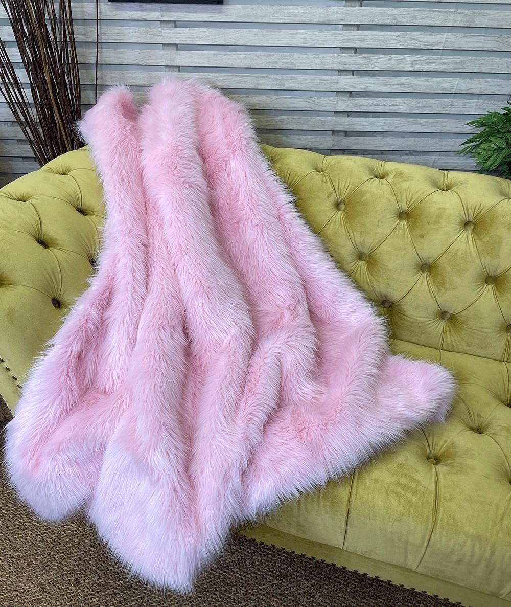 Modern pink coloured faux fur sofa throw