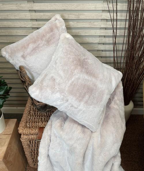 Pastel coloured faux fur cushions