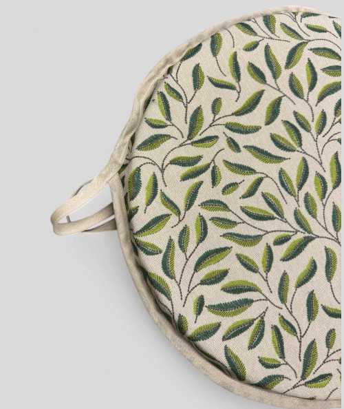 Green and beige round seat pads with a modern two-tone green leaf design