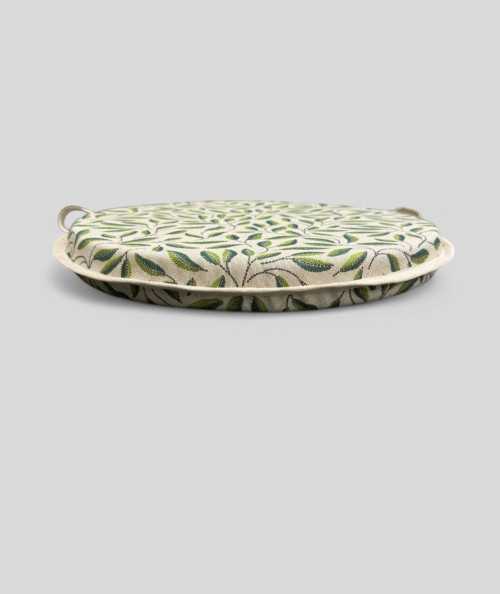 Green and beige round chair pads with a modern two-tone green leaf design