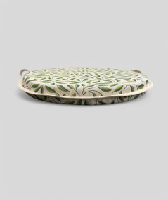 Green and beige round chair pads with a modern two-tone green leaf design