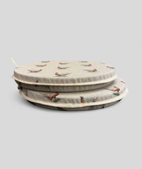 Extra thick linen style round seat pads in a small pheasant design on a beige base