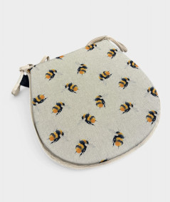 Classic D shaped seat pads in beige linen with a small bee print