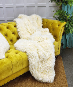 Luxury long, curly haired cream faux fur sofa throw