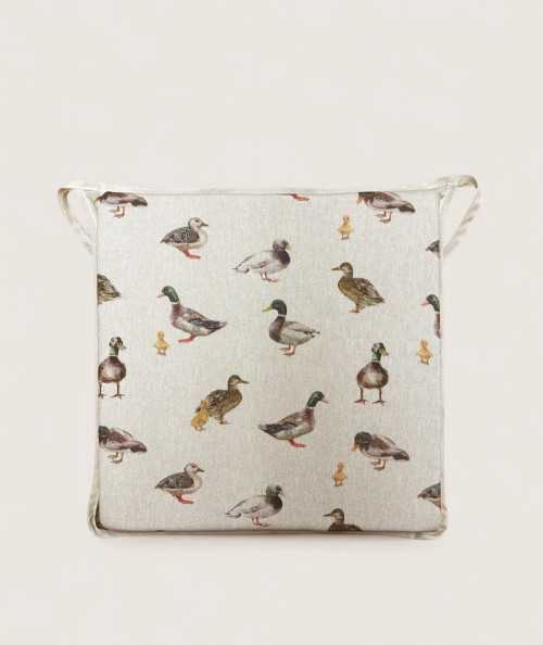 Square shaped non-slip seat pads in beige with a modern duck design