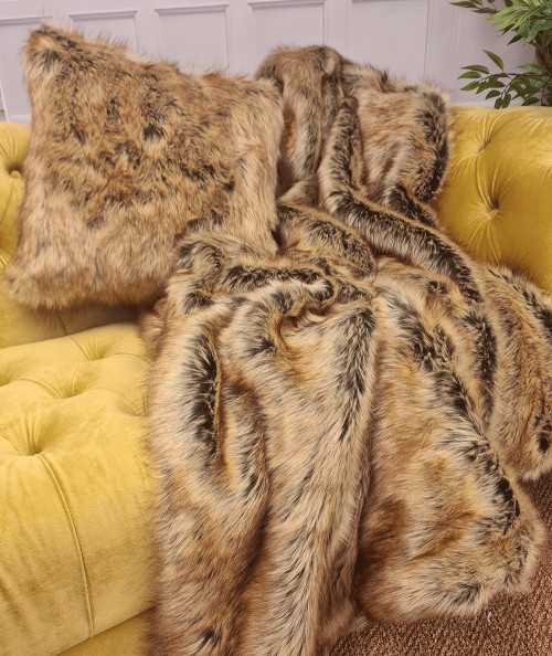 Luxury long-haired brown and beige faux fur sofa throw