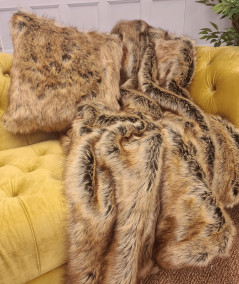Luxury long-haired brown and beige faux fur sofa throw