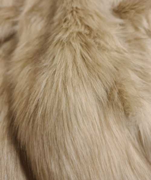 Close up image of the oatmeal coloured faux fur