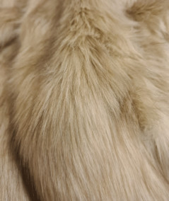 Close up image of the oatmeal coloured faux fur