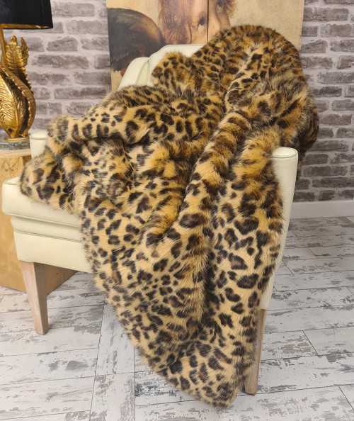 Luxury leopard print throw in gold and brown toned faux fur