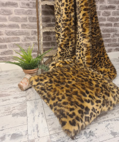 Luxury leopard print blanket in gold and brown toned faux fur