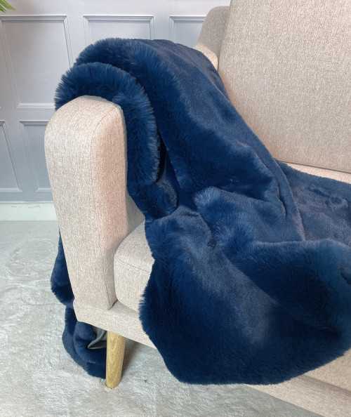 Plain blue faux fur bed runner